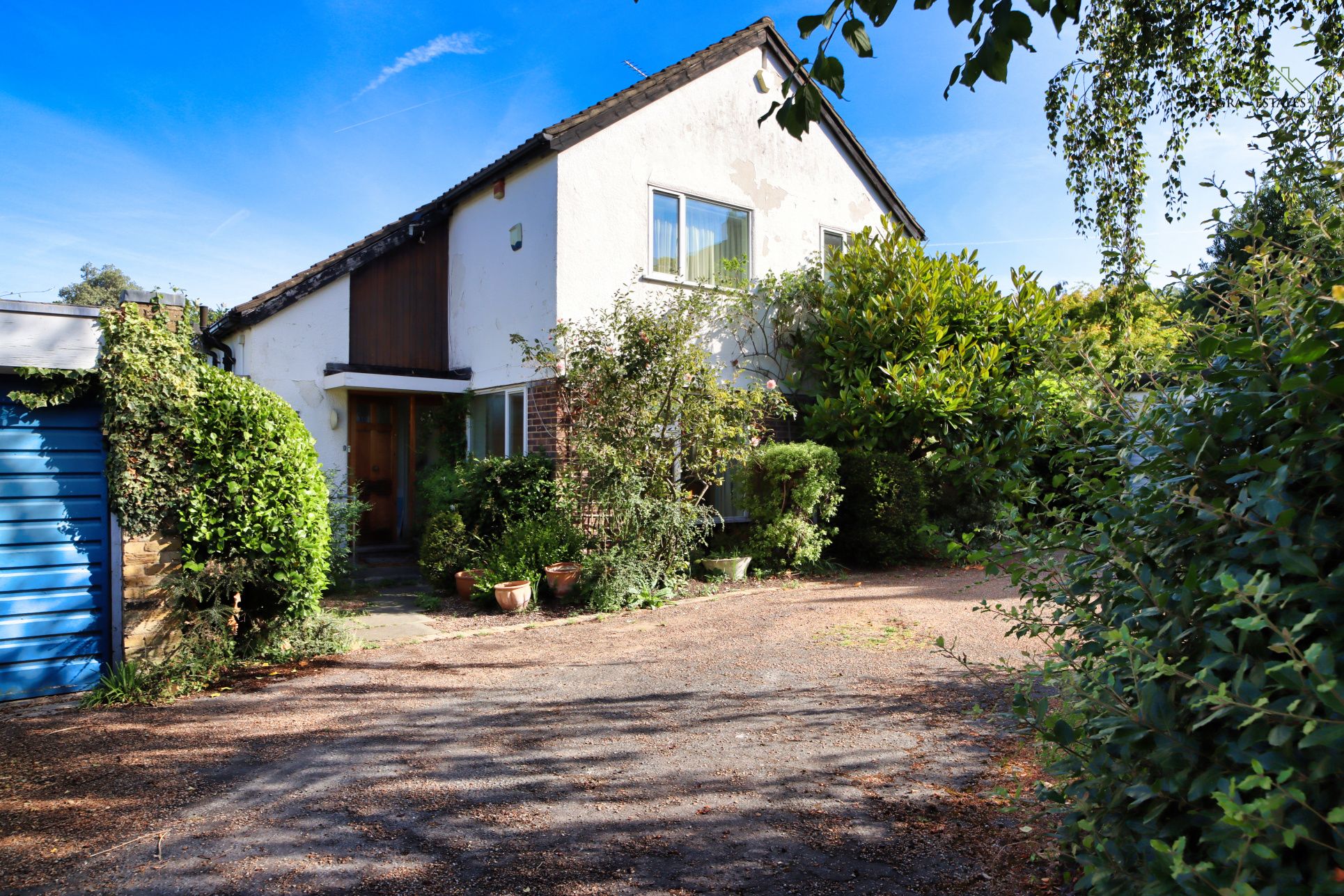 Detached home set back from the road with a spacious driveway, mature trees, and established greenery surrounding the entrance. The property has a private feel, with natural landscaping and plenty of scope for modernisation, making it ideal for buyers looking to create a home tailored to their style. The setting combines privacy with convenience, reflecting the type of property highly sought after in Beckenham, Bromley, and surrounding South East London areas.