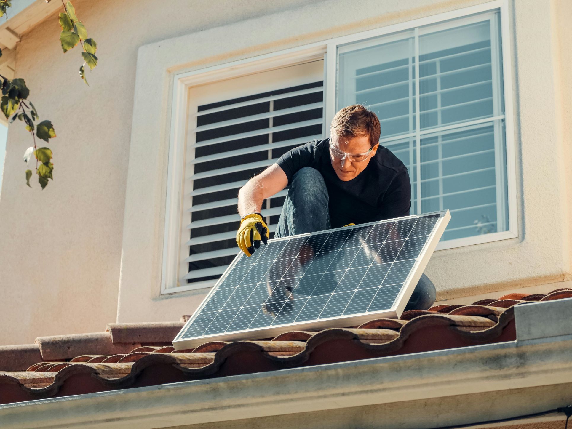 A homeowner installing solar panels on a roof, highlighting the growing trend of sustainable and eco-friendly properties. Solar panels not only reduce household running costs but also increase property values across South East London areas such as Beckenham, Bromley, Orpington, and Catford. Buyers are increasingly drawn to homes with energy-efficient upgrades that support long-term savings and environmental responsibility.