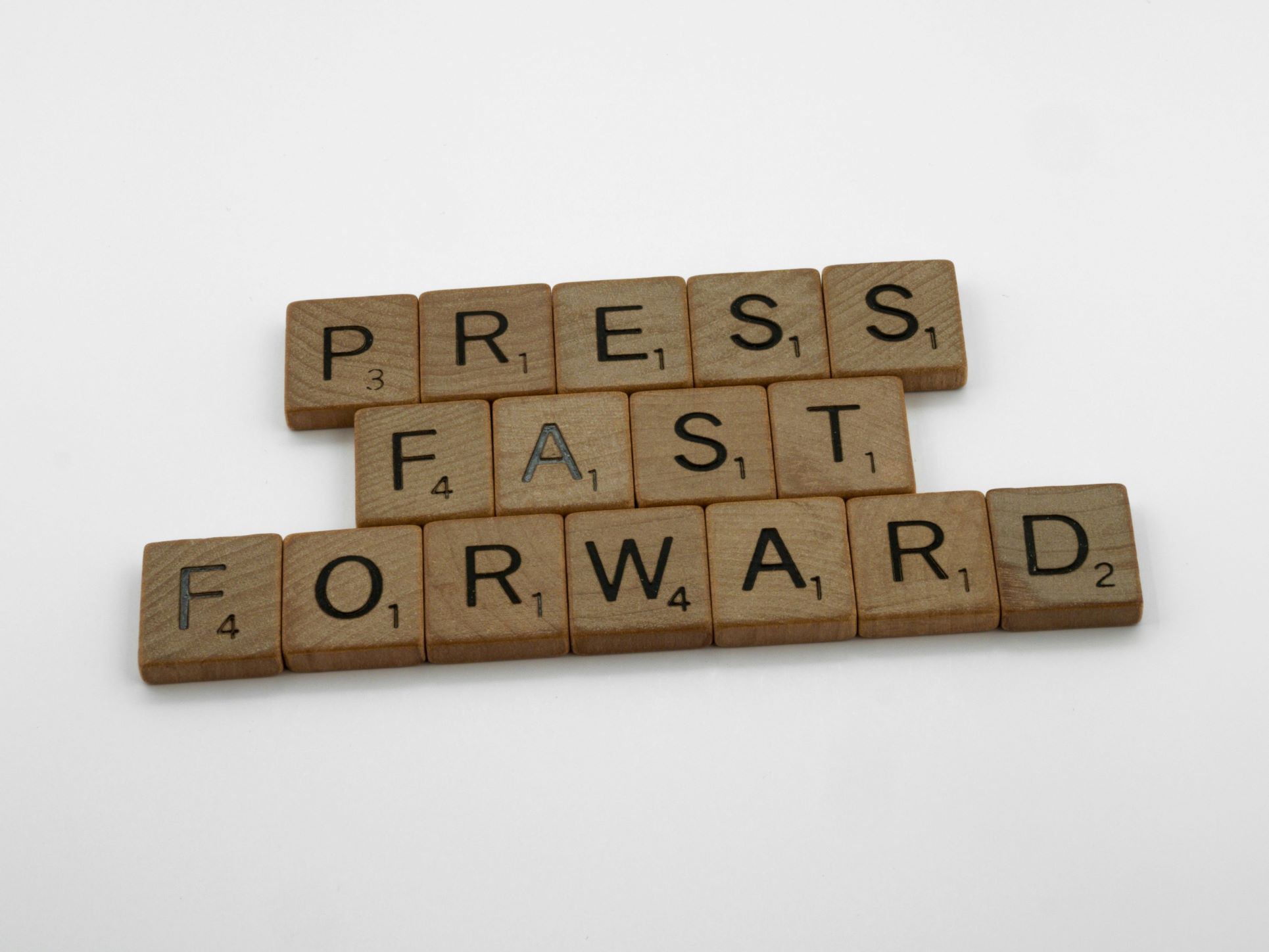 Wooden Scrabble tiles spelling out “Press Fast Forward,” symbolising momentum and progress. At Integra Estates, we help clients fast forward their property journey — whether buying, selling, or valuing homes in Beckenham, Bromley, Orpington, Catford, or wider South East London. With our expert marketing, local insight, and honest approach, we ensure your property goals move forward at pace.