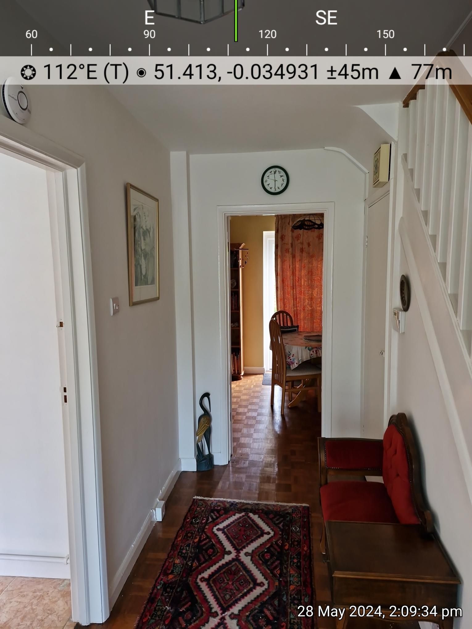 Traditional hallway with wooden flooring and view into dining room, photographed by a Beckenham estate agent to showcase interior character and homely charm.