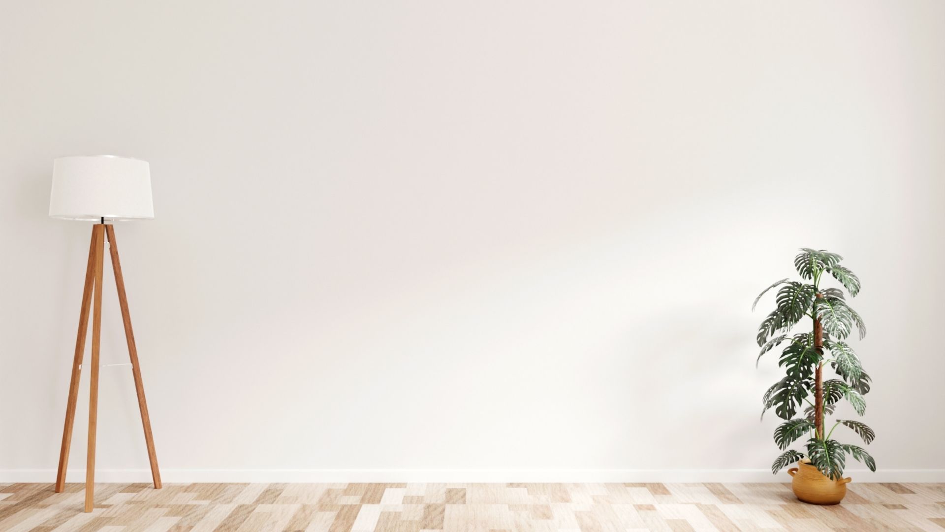 A minimalist interior scene with a wooden tripod floor lamp on the left and a tall potted plant on the right, set against a plain white wall and light patterned wooden flooring, creating a clean and modern aesthetic.
