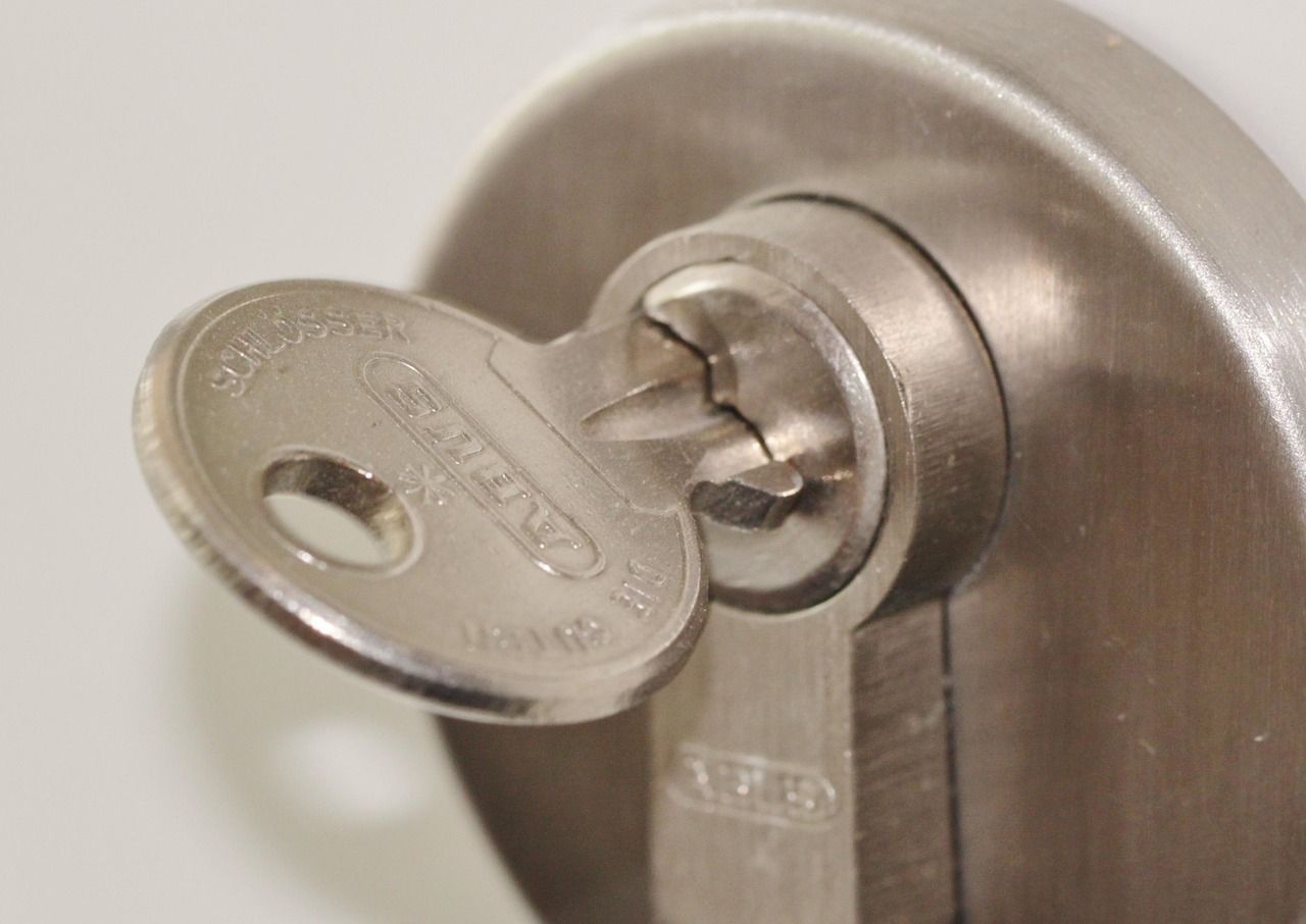 Close-up of a key in a secure door lock, symbolising new beginnings and homeownership with the support of a trusted Beckenham estate agent.