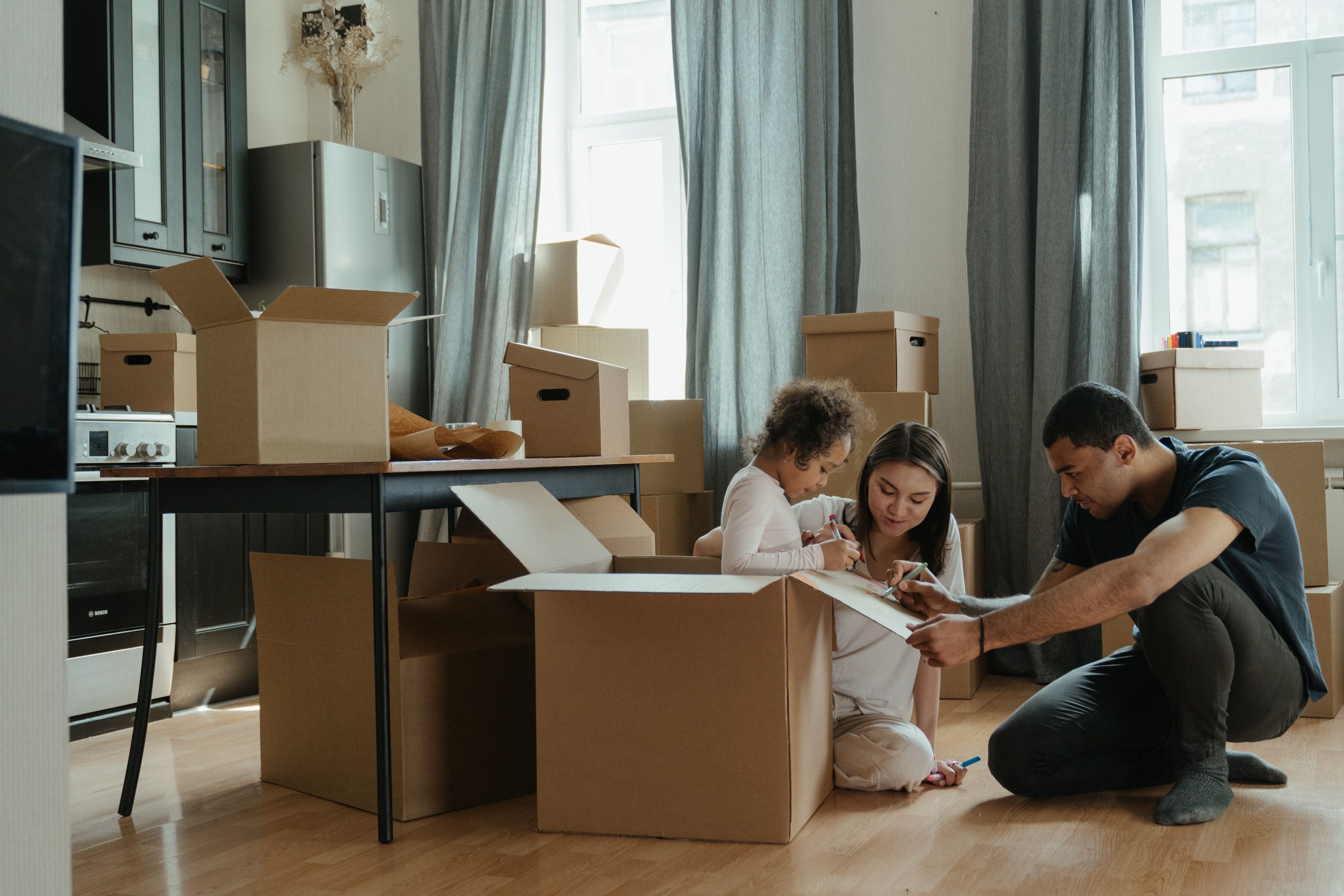 couple with their child preparing to move home
