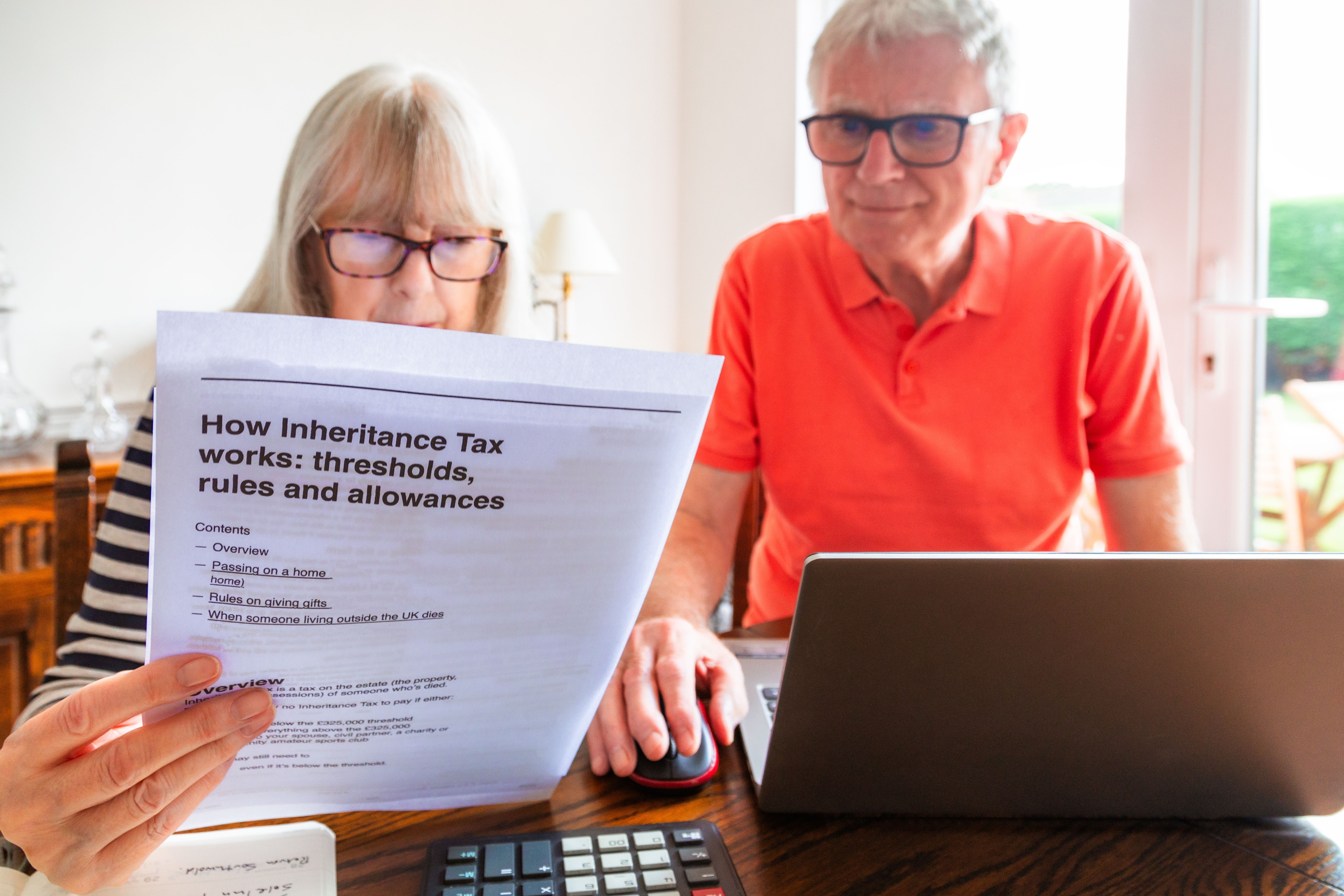 image of an elderly couple reading a document about inheritance tax